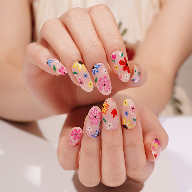 Stickers ongles en gel fleuris multicolores sur fond transparent rosé